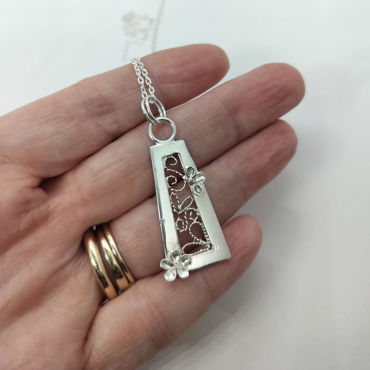 Trapezium Shaped Pendant with Flowers and Filigree Inset