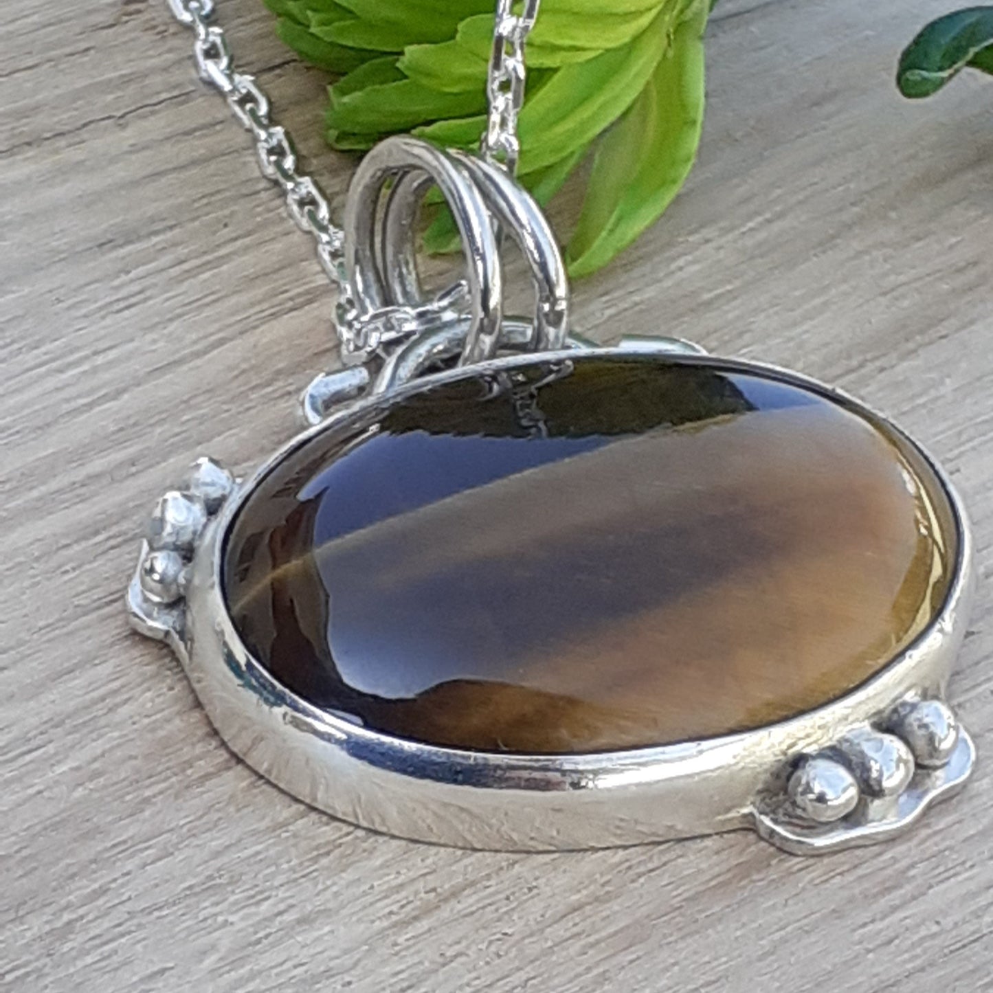 Two Little Birds Oval Tigers Eye Stone
