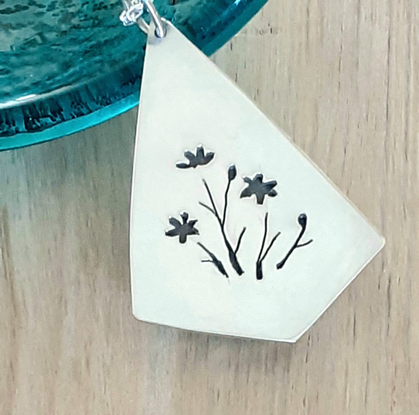 Geometric Shape with Teardrop Stone and Hidden Flowers