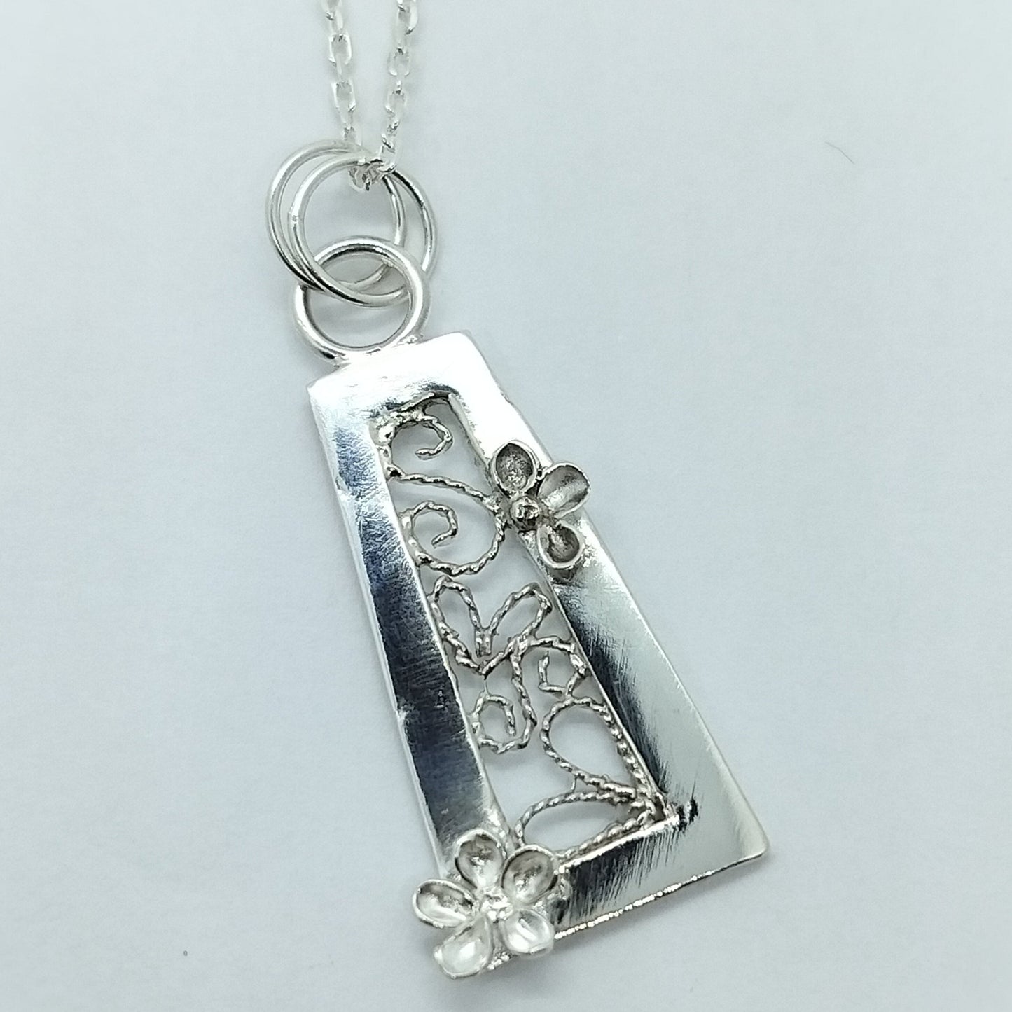 Trapezium Shaped Pendant with Flowers and Filigree Inset